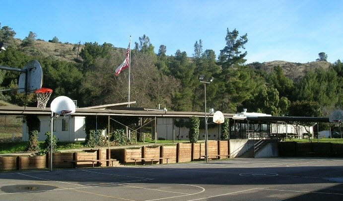 View of a courtyard at James Ranch with basketball courts