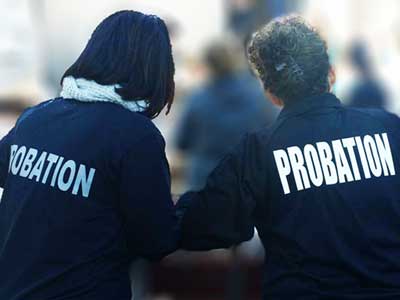 two ladies wearing probation t-shirts