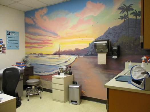 Mural on the wall of a room of a sunset on the beach